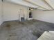 Spacious two car garage with stairs leading to an interior door at 8120 Berrywood Ct, Covington, GA 30014