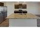 Spacious modern kitchen featuring stainless steel appliances, granite countertops, and ample cabinet space at 8120 Berrywood Ct, Covington, GA 30014
