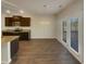Bright kitchen and dining area boasts modern appliances, granite counters, and access to outdoor space at 8120 Berrywood Ct, Covington, GA 30014