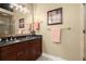 Modern bathroom with double sink vanity, dark countertop, and walk-in glass shower at 1459 Village Park Ct, Atlanta, GA 30319