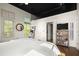 Bright bedroom with views of the exterior and a tv with a bookshelf at 1459 Village Park Ct, Atlanta, GA 30319