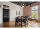 Dining room featuring hardwood floors, exposed brick wall, and natural light at 1459 Village Park Ct, Atlanta, GA 30319
