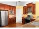 View of a kitchen, showcasing dark wood cabinetry and stainless steel appliances at 1459 Village Park Ct, Atlanta, GA 30319