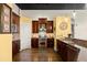 A gourmet kitchen featuring stainless steel appliances, dark wood cabinetry, and a large island at 1459 Village Park Ct, Atlanta, GA 30319