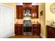 Kitchen featuring stainless steel stove and backsplash at 1459 Village Park Ct, Atlanta, GA 30319