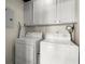 Bright laundry room featuring a washer and dryer at 1459 Village Park Ct, Atlanta, GA 30319