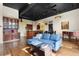 Open living space with kitchen bar, hardwood floors, and bright lighting at 1459 Village Park Ct, Atlanta, GA 30319