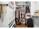 Spacious walk-in closet with built-in shelving, drawers, and hanging rods at 1459 Village Park Ct, Atlanta, GA 30319