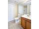 Bathroom featuring tile floors, wood cabinets and a large mirror reflecting the shower at 1614 Carrie Farm Ct, Kennesaw, GA 30144