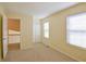 Bright bedroom with neutral carpeting and two large windows bringing in natural light at 1614 Carrie Farm Ct, Kennesaw, GA 30144