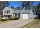 Well-maintained two-story home featuring a garage and a neat driveway at 1614 Carrie Farm Ct, Kennesaw, GA 30144