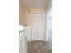 Hallway with closet and view of the second floor featuring neutral carpeting at 1614 Carrie Farm Ct, Kennesaw, GA 30144