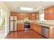 Bright kitchen with stainless steel appliances, wood floors, and ample cabinet space at 1614 Carrie Farm Ct, Kennesaw, GA 30144