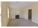 Bright living room featuring a fireplace and new carpet at 1614 Carrie Farm Ct, Kennesaw, GA 30144