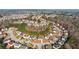 Wide aerial shot showcasing a peaceful neighborhood with neatly arranged homes and natural surroundings at 3308 Hunting Creek Pass, Douglasville, GA 30135