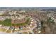Expansive aerial view of a quiet residential neighborhood with winding streets and mature trees at 3308 Hunting Creek Pass, Douglasville, GA 30135