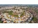 Overhead view of a charming community featuring cozy homes nestled amongst lush greenery at 3308 Hunting Creek Pass, Douglasville, GA 30135