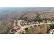 An aerial perspective of houses located on a tranquil street, backed by a dense forest at 3308 Hunting Creek Pass, Douglasville, GA 30135