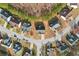 Bird's eye view of a home with a dark roof, surrounded by mature trees and neighborhood streets at 3308 Hunting Creek Pass, Douglasville, GA 30135