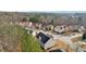 A high-angle shot of the houses in a neighborhood, with many trees surrounding the homes at 3308 Hunting Creek Pass, Douglasville, GA 30135