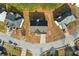 Straight down aerial view of a home on corner lot with mature trees and winding street at 3308 Hunting Creek Pass, Douglasville, GA 30135