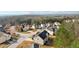 Overhead photo of a house in a neighborhood, nestled among trees, highlighting its setting at 3308 Hunting Creek Pass, Douglasville, GA 30135