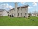 Backyard featuring a grassy lawn, patio and the rear exterior of the house at 3308 Hunting Creek Pass, Douglasville, GA 30135