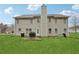 Backyard featuring a grassy lawn, patio and the rear exterior of the house at 3308 Hunting Creek Pass, Douglasville, GA 30135