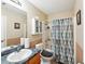 Functional bathroom features a vanity, toilet, and shower-tub combination at 3308 Hunting Creek Pass, Douglasville, GA 30135