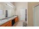Well-lit bathroom with double vanity and neutral decor creates a relaxing and functional space at 3308 Hunting Creek Pass, Douglasville, GA 30135