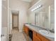 Bright bathroom with double vanity and tile flooring provides convenience and style at 3308 Hunting Creek Pass, Douglasville, GA 30135