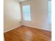 Bedroom with hardwood floors, window with blinds, and neutral wall paint at 3308 Hunting Creek Pass, Douglasville, GA 30135