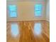 Large bedroom with hardwood flooring and a view from the big, sunny windows at 3308 Hunting Creek Pass, Douglasville, GA 30135