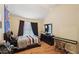 Simple bedroom features a comfortable bed, wood floors, and simple decor at 3308 Hunting Creek Pass, Douglasville, GA 30135
