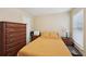 Comfortable bedroom featuring laminate flooring, ample natural light, and traditional-style wood furniture at 3308 Hunting Creek Pass, Douglasville, GA 30135