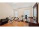 Neutral bedroom with hardwood floors and natural light from two windows at 3308 Hunting Creek Pass, Douglasville, GA 30135