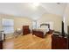 Spacious bedroom with hardwood floors, vaulted ceiling, and natural light from the windows at 3308 Hunting Creek Pass, Douglasville, GA 30135