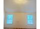 Bright bedroom featuring hardwood floors and big windows at 3308 Hunting Creek Pass, Douglasville, GA 30135