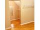 Spacious walk-in closet with wooden floor and closet rod at 3308 Hunting Creek Pass, Douglasville, GA 30135