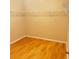 Walk-in closet featuring hardwood floors and rod for hanging clothes at 3308 Hunting Creek Pass, Douglasville, GA 30135