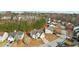Two-story home with a manicured lawn, nestled in a community with mature trees and winding streets at 3308 Hunting Creek Pass, Douglasville, GA 30135