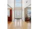 Grand foyer with soaring ceilings, tile flooring, and abundant natural light streaming through the front door's transom window at 3308 Hunting Creek Pass, Douglasville, GA 30135