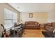 Cozy living room featuring hardwood floors and a large window with blinds at 3308 Hunting Creek Pass, Douglasville, GA 30135