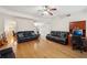 Open-concept living room with hardwood floors and ample natural light at 3308 Hunting Creek Pass, Douglasville, GA 30135