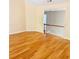 Spacious living room with staircase, beautiful hardwood floors, and plenty of natural light at 3308 Hunting Creek Pass, Douglasville, GA 30135
