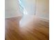 Bright living room featuring hardwood floors, neutral walls and staircase at 3308 Hunting Creek Pass, Douglasville, GA 30135