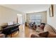Bright living room showcasing hardwood floors, natural light, and ample seating at 3308 Hunting Creek Pass, Douglasville, GA 30135