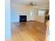 Bright living room with wood floors, fireplace, and ceiling fan create a cozy and inviting space at 3308 Hunting Creek Pass, Douglasville, GA 30135