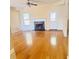 Bright living room with hardwood floors and a fireplace make a perfect space for relaxation at 3308 Hunting Creek Pass, Douglasville, GA 30135