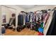 Large walk-in closet featuring hardwood floors and extensive shelving and hanging space at 3308 Hunting Creek Pass, Douglasville, GA 30135